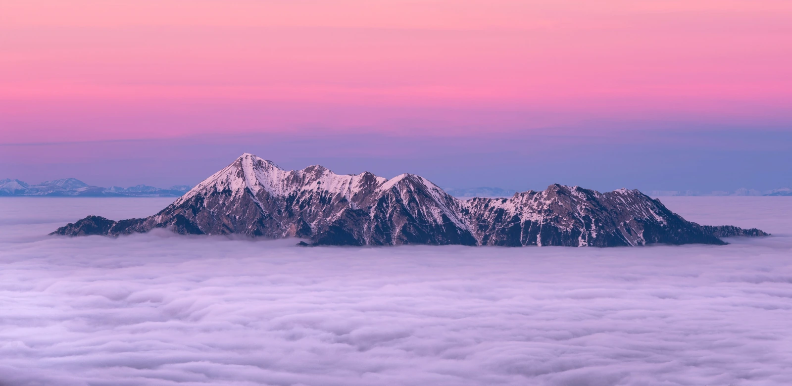 A single snow-capped peak above a sea of cloud, for Numminen Advisory transfer pricing services